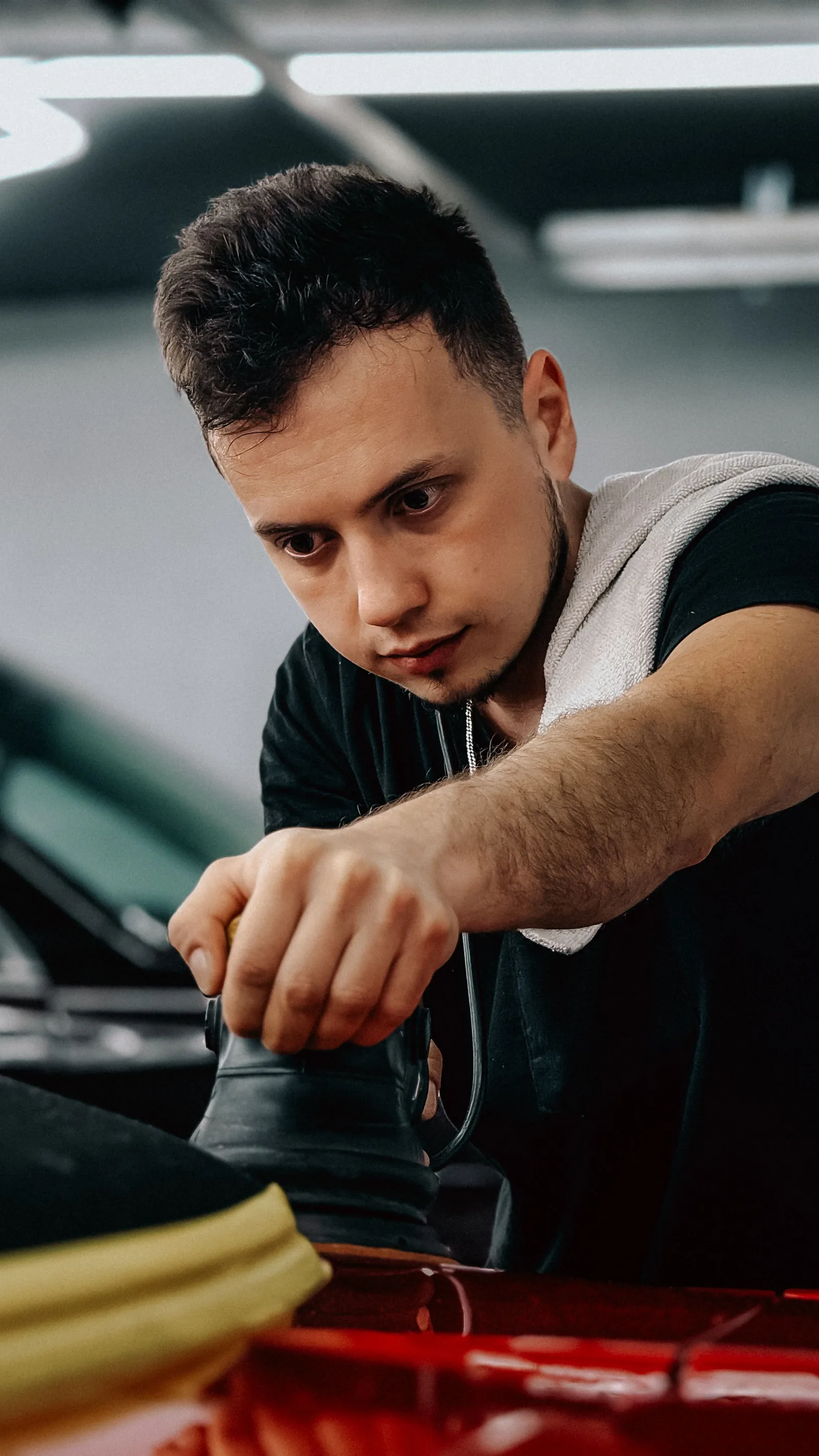 Marco polishing a red car